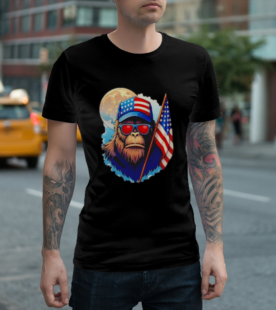 Bigfoot USA Flag Hat Sunglasses Patriotic Moon Background T-Shirt