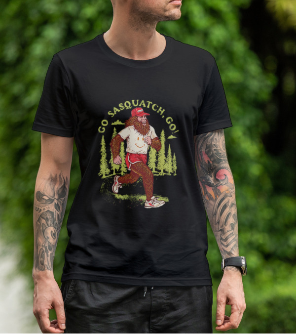 Go Sasquatch Go Bigfoot Jogging In Forest With Red Cap And Sneakers T-Shirt