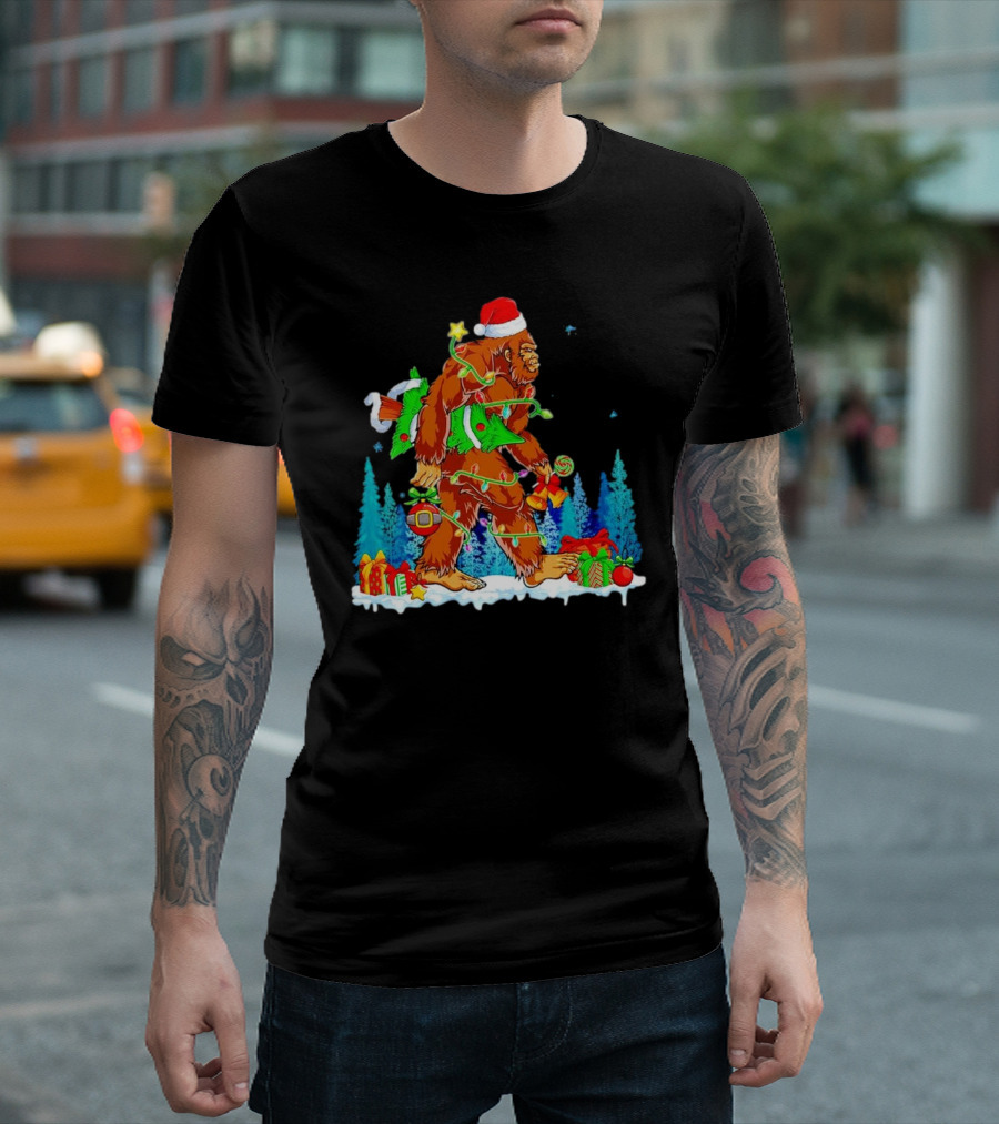 Bigfoot Santa Hugging Christmas Tree with Gifts and Snow Scene T-Shirt