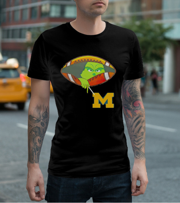 Grinch Peeking From Football Over Michigan Wolverines T-Shirt
