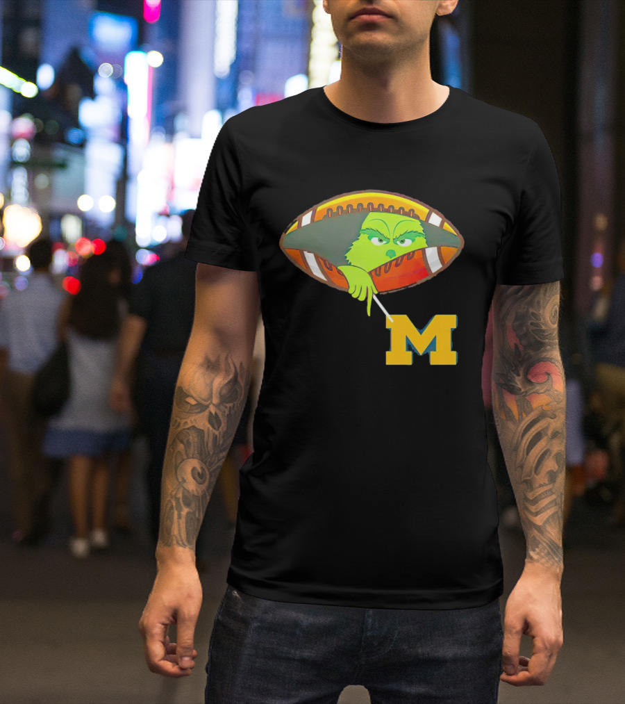 Grinch Peeking From Football Over Michigan Wolverines T-Shirt