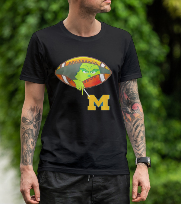 Grinch Peeking From Football Over Michigan Wolverines T-Shirt