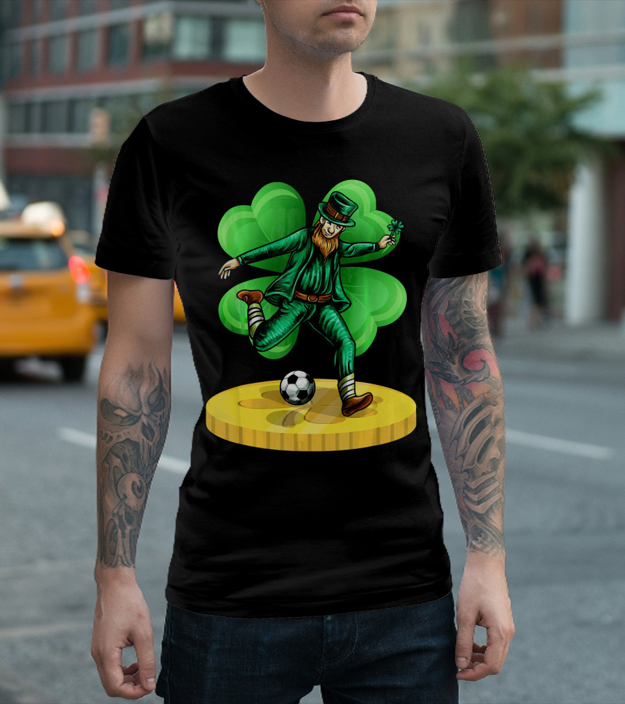 Leprechaun Kicking Soccer Ball On Gold Coin With Shamrock Background T-Shirt
