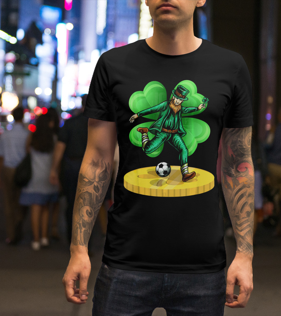 Leprechaun Kicking Soccer Ball On Gold Coin With Shamrock Background T-Shirt