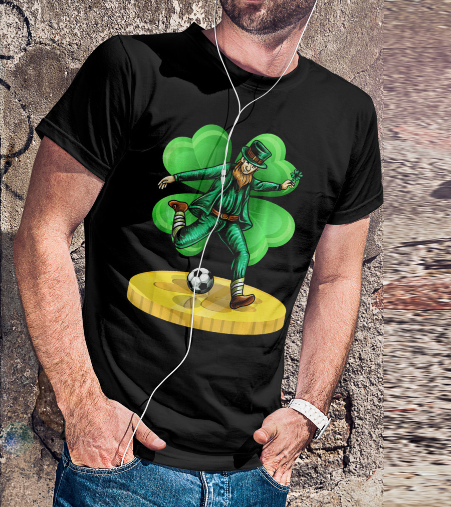 Leprechaun Kicking Soccer Ball On Gold Coin With Shamrock Background T-Shirt