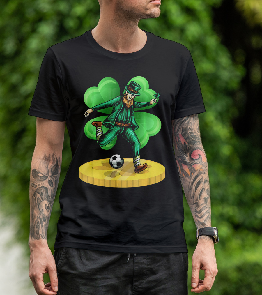 Leprechaun Kicking Soccer Ball On Gold Coin With Shamrock Background T-Shirt