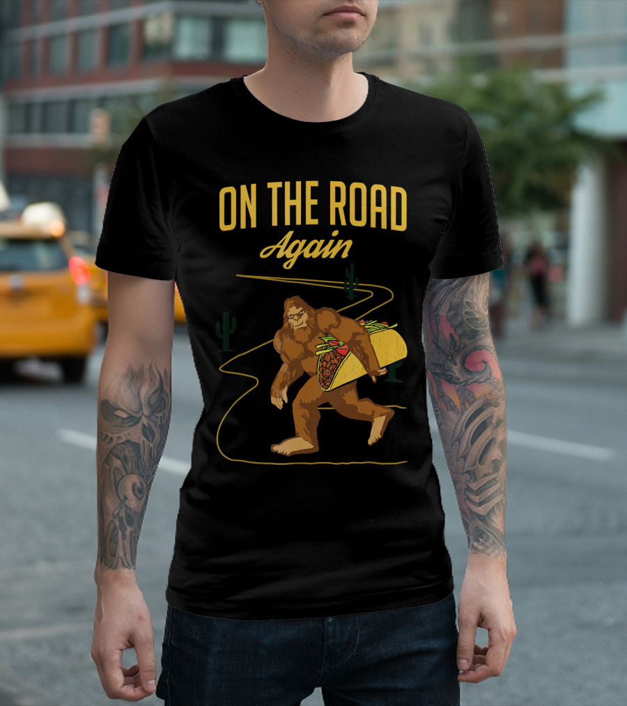 ON THE ROAD AGAIN Smirk Bigfoot Sasquatch Carrying Taco T-Shirt