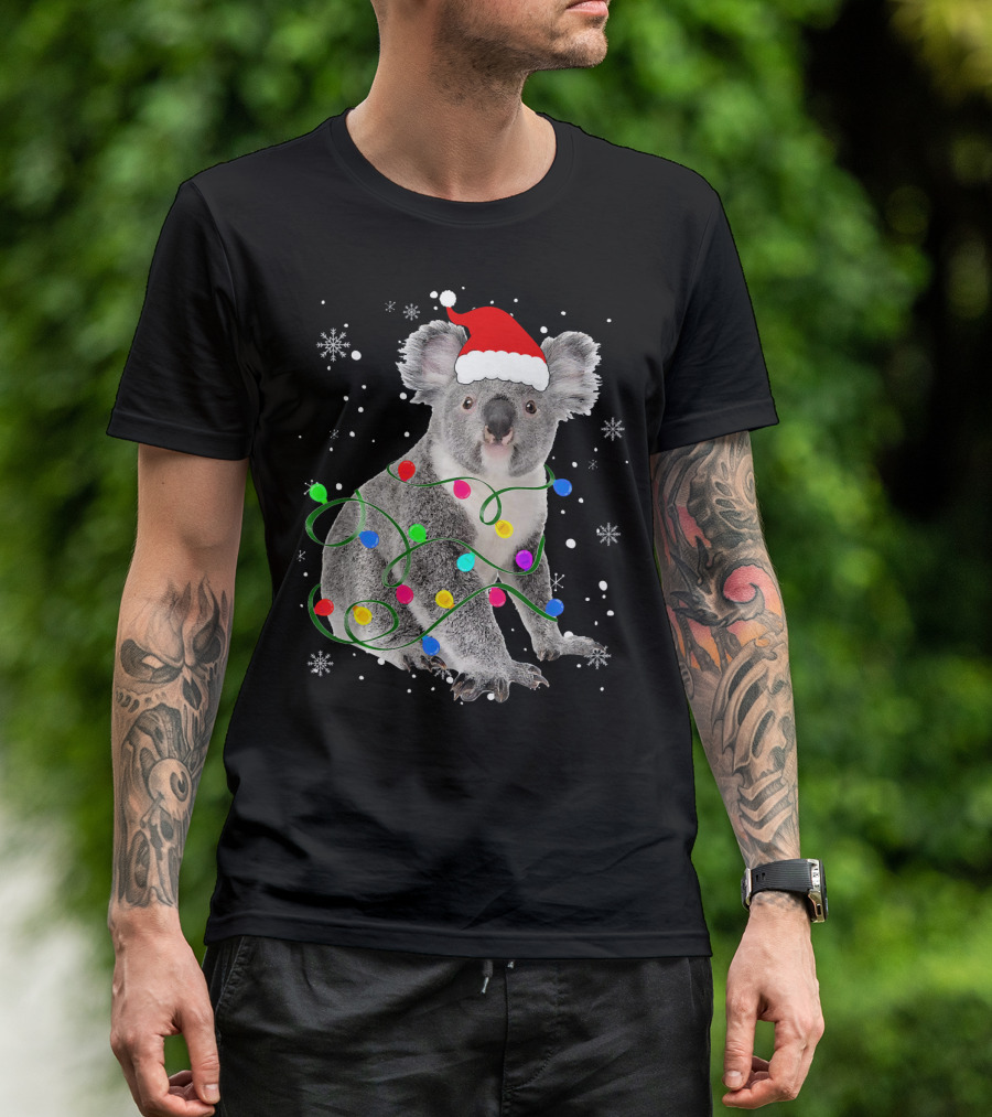 Koala Wrapped In Christmas Lights Wearing Santa Hat With Snowflakes Matching Fam T-Shirt