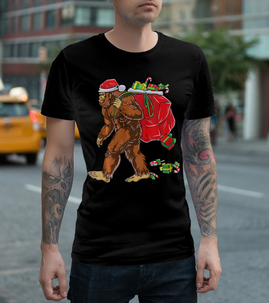 Bigfoot Santa Carrying Gifts With Candy Canes T-Shirt