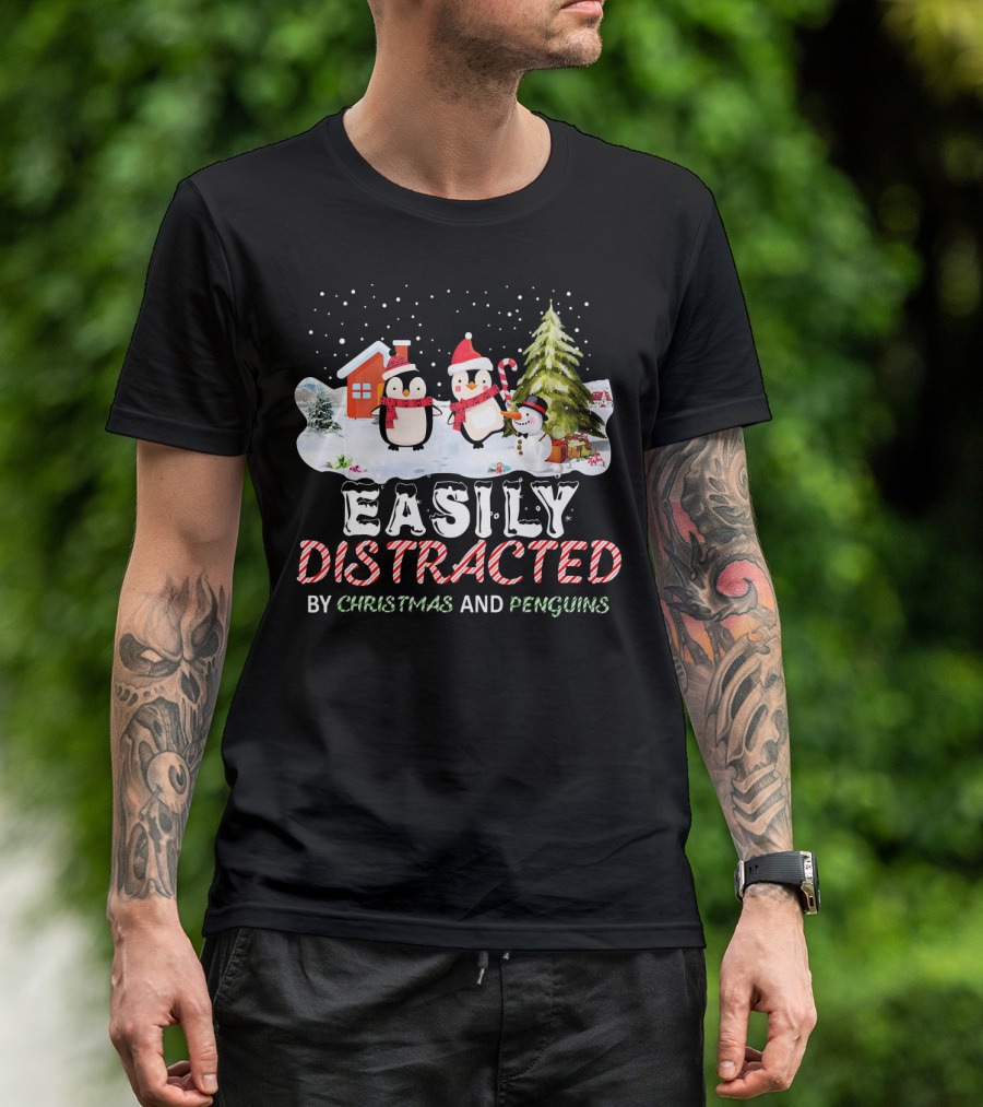 Easily Distracted By Christmas And Penguins In Winter Wonderland With Snowman House And Tree T-Shirt