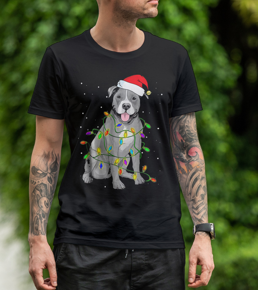 Pitbull In Santa Hat Wrapped In Christmas Lights With Snowy Background T-Shirt