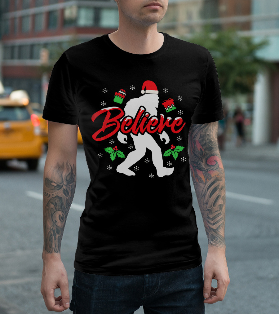 Believe Bigfoot Christmas Santa Hat Snowflakes Holly T-Shirt