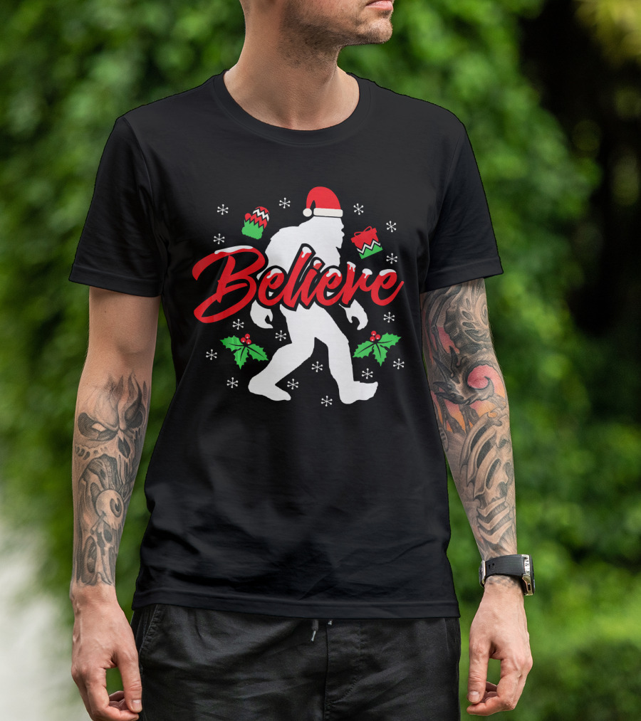 Believe Bigfoot Christmas Santa Hat Snowflakes Holly T-Shirt
