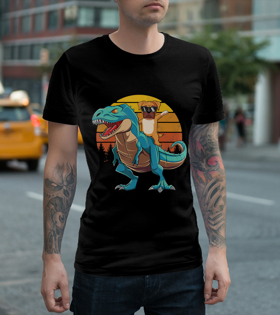 Boxer Dog With Sunglasses Riding Blue T-Rex Against Sunset Background T-Shirt