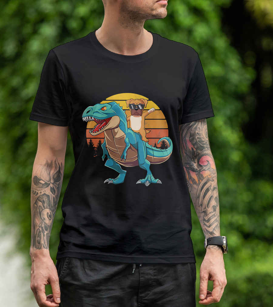 Boxer Dog With Sunglasses Riding Blue T-Rex Against Sunset Background T-Shirt
